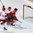 PARIS, FRANCE - MAY 10: Switzerland's Reto Schappi #19 scores while Belarus's Kristian Khenkel #18 and Dmitri Korobov #89 look on during preliminary round action at the 2017 IIHF Ice Hockey World Championship. (Photo by Matt Zambonin/HHOF-IIHF Images)
